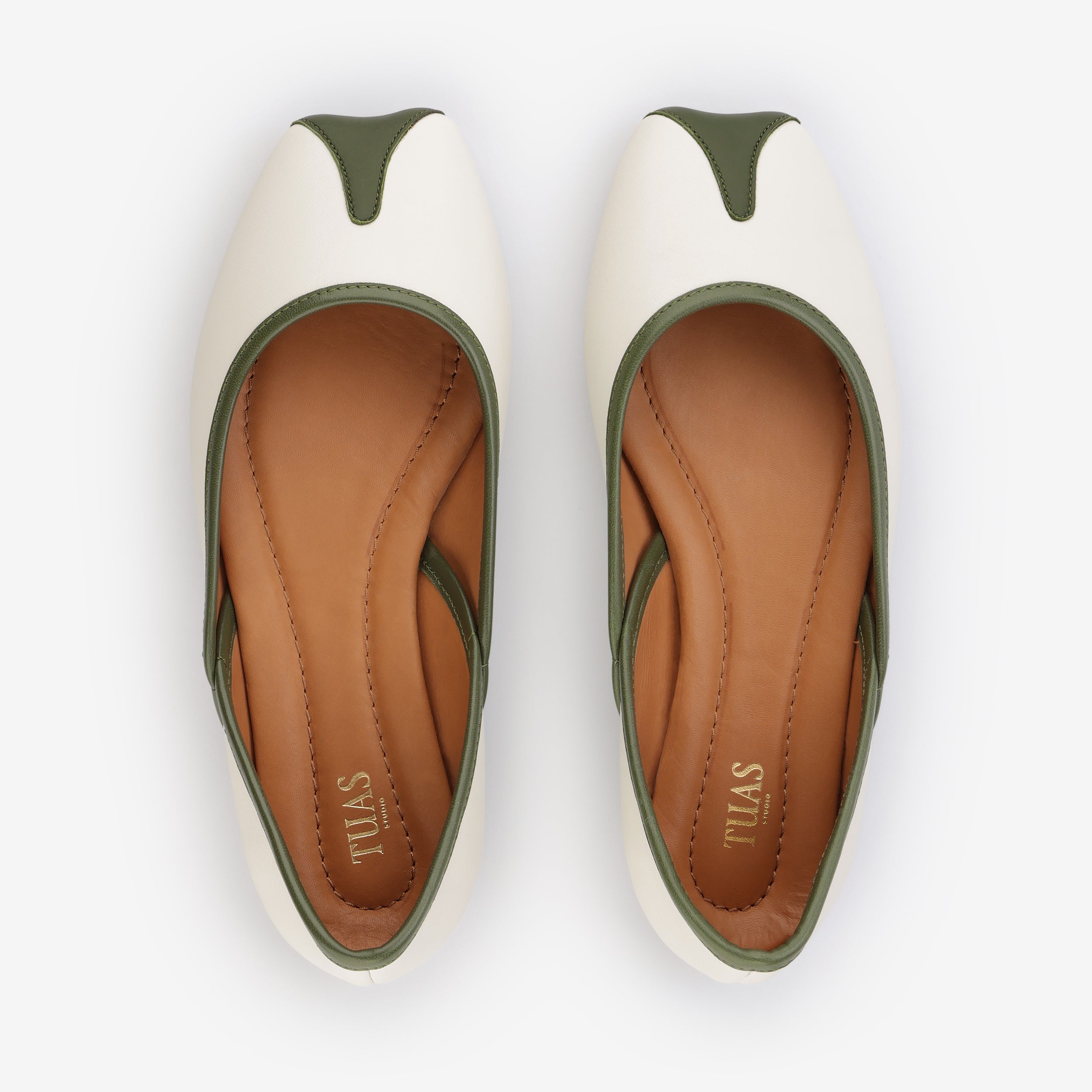 TUAS Julia nude flat shoe with green accents on a white background