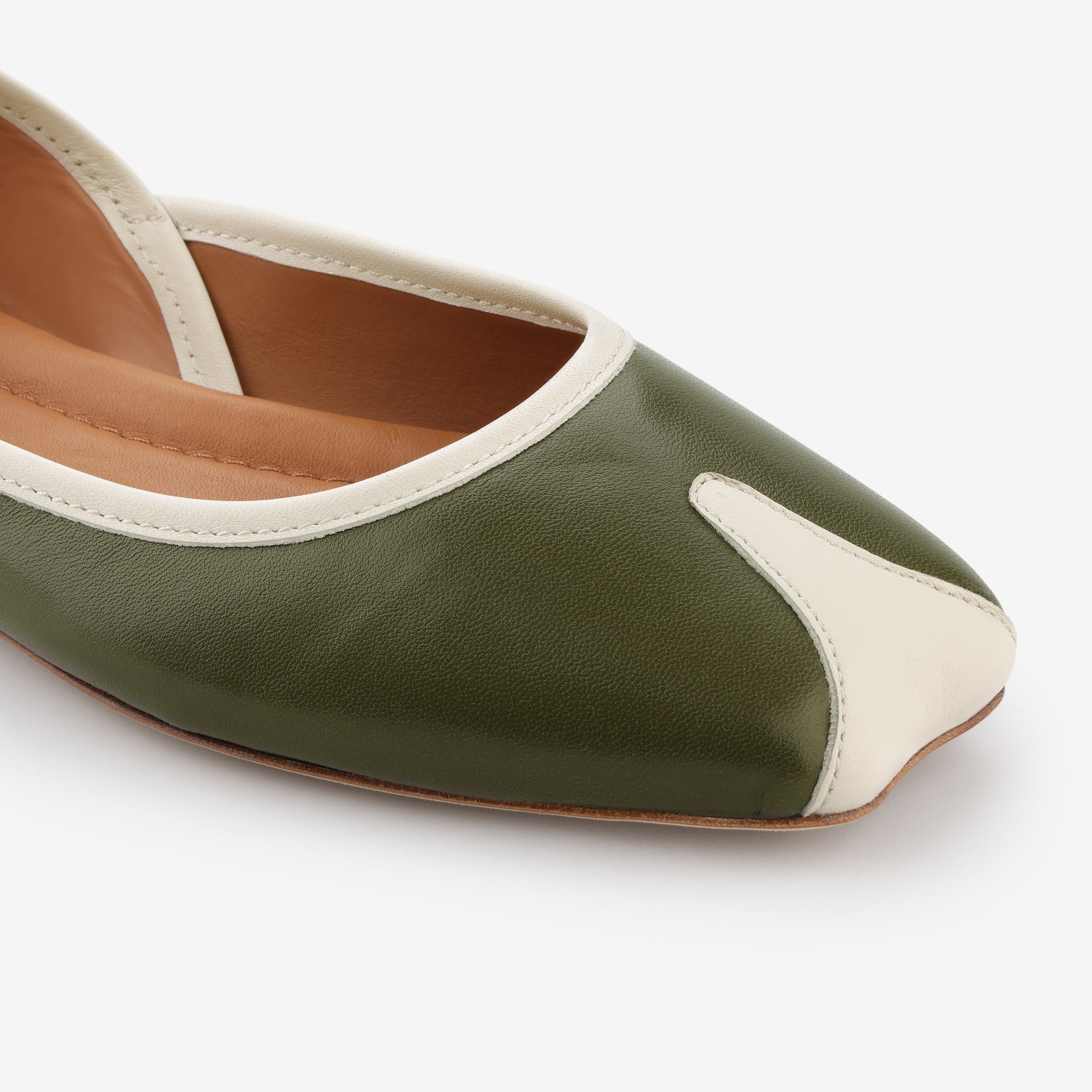 TUAS Julia olive green flat shoe with white accents on a white background