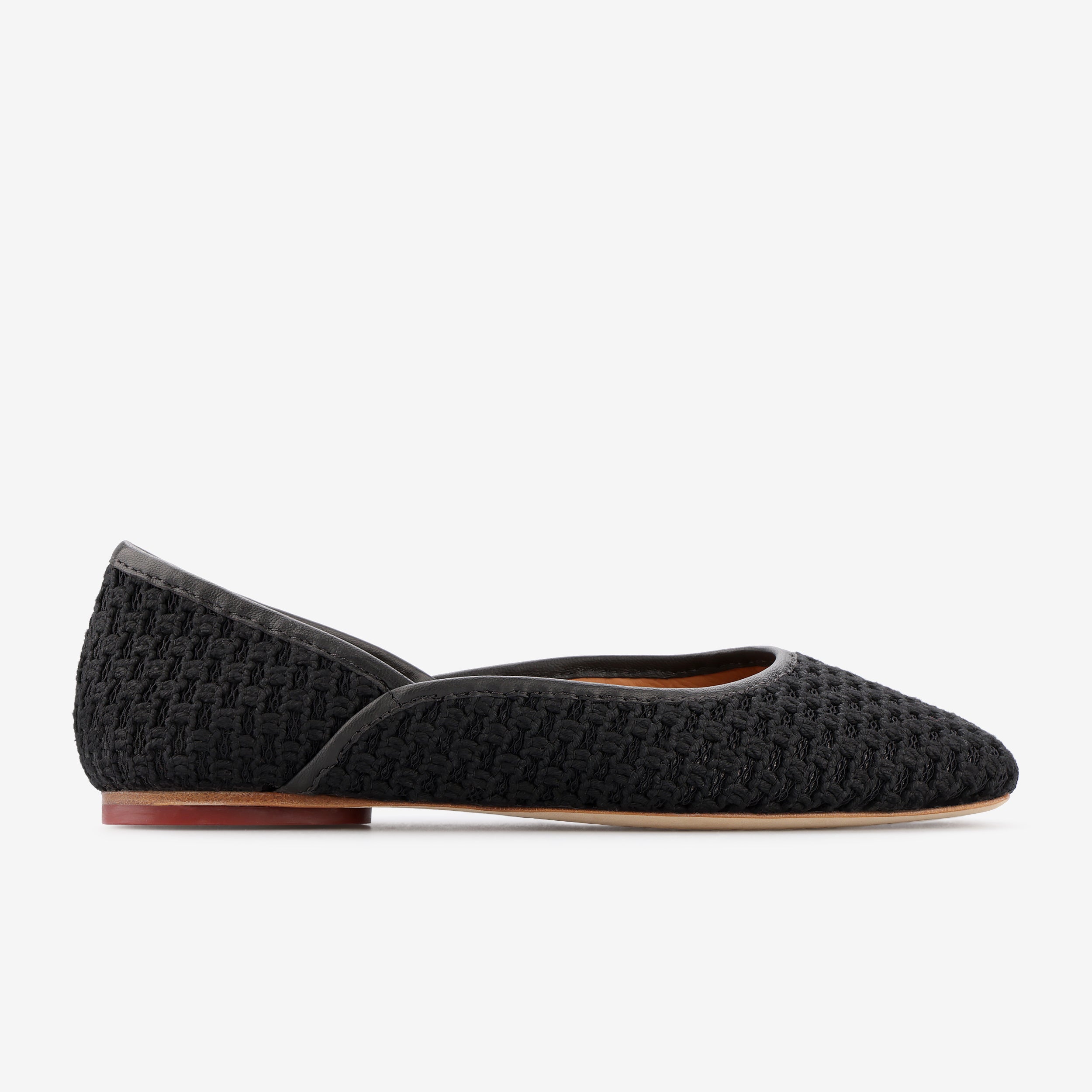TUAS Louise black flat shoe with texture on a white background