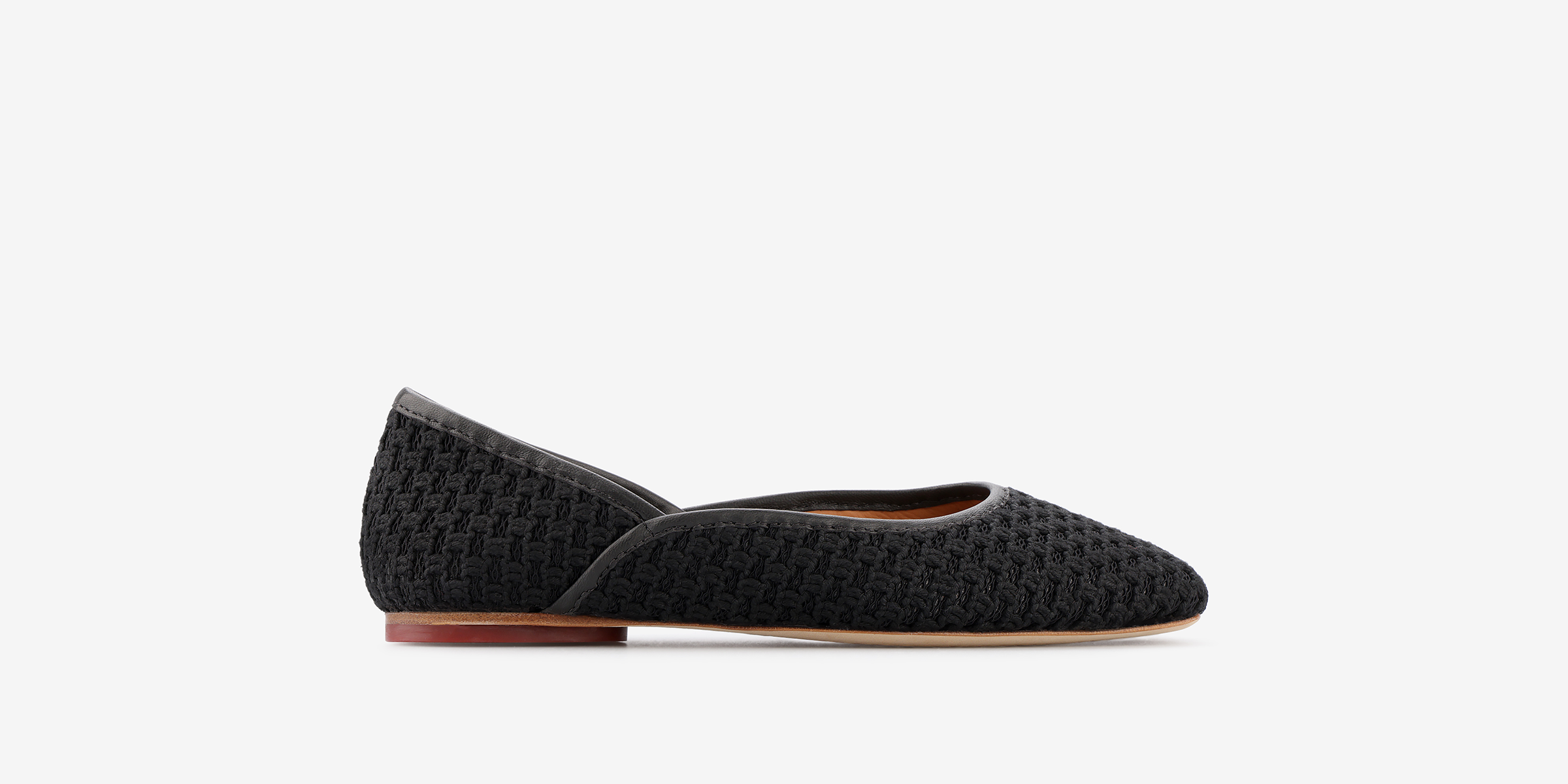 TUAS Louise black flat shoe with texture on a white background