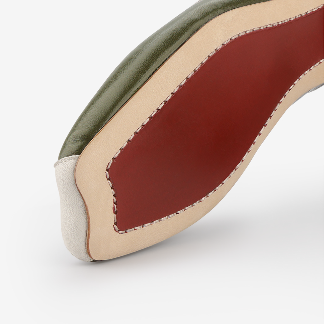 Close-up of a shoe sole with red insole on a white background