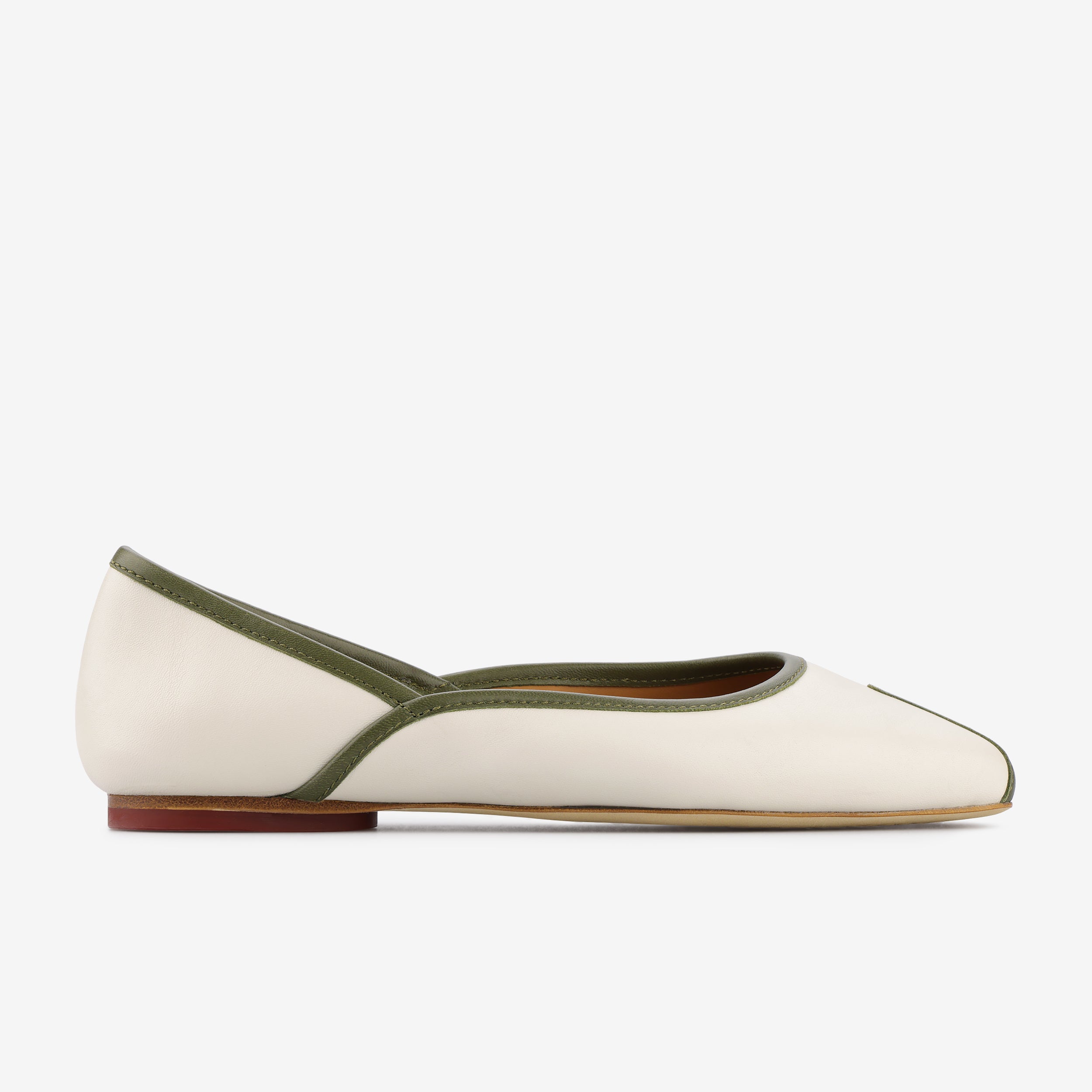 TUAS Julia nude flat shoe with green accents on a white background