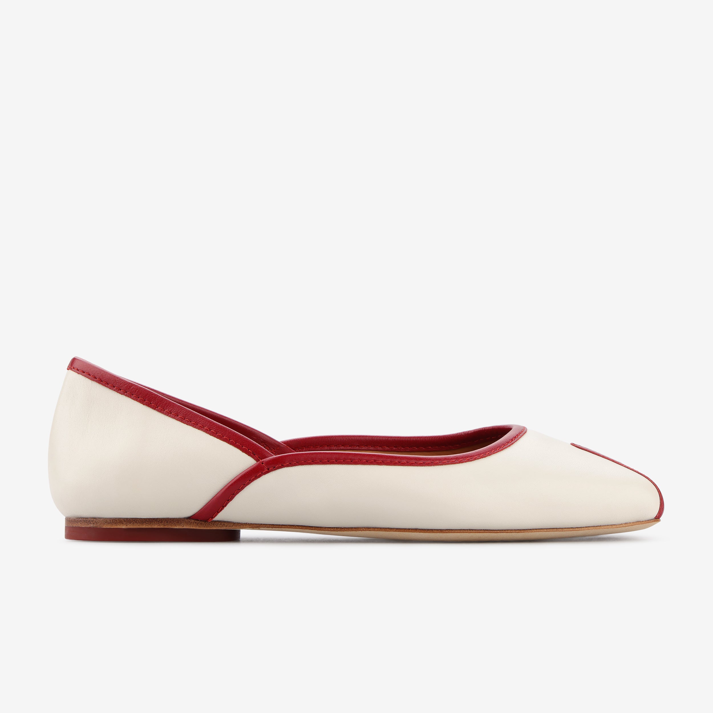 TUAS Julia nude flat shoe with red accents on a white background