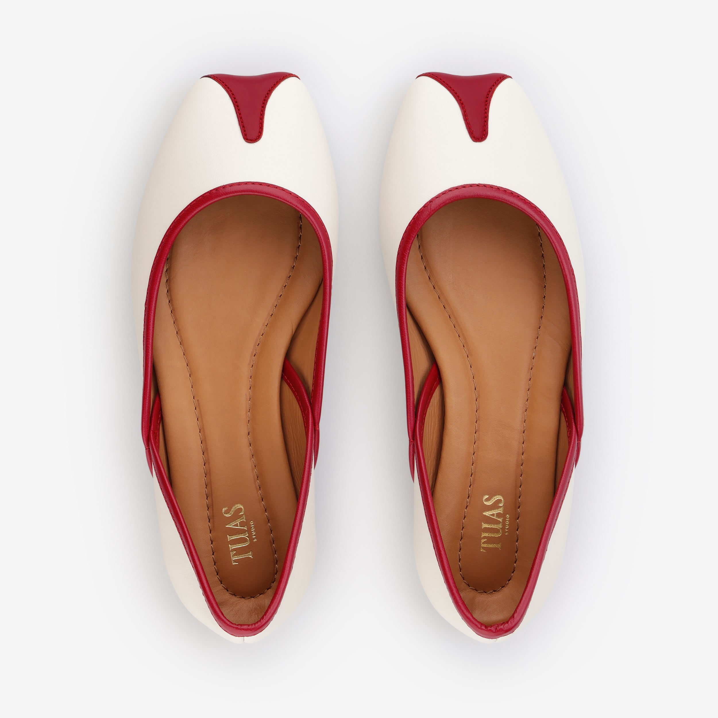 TUAS Julia nude flat shoe with red accents on a white background