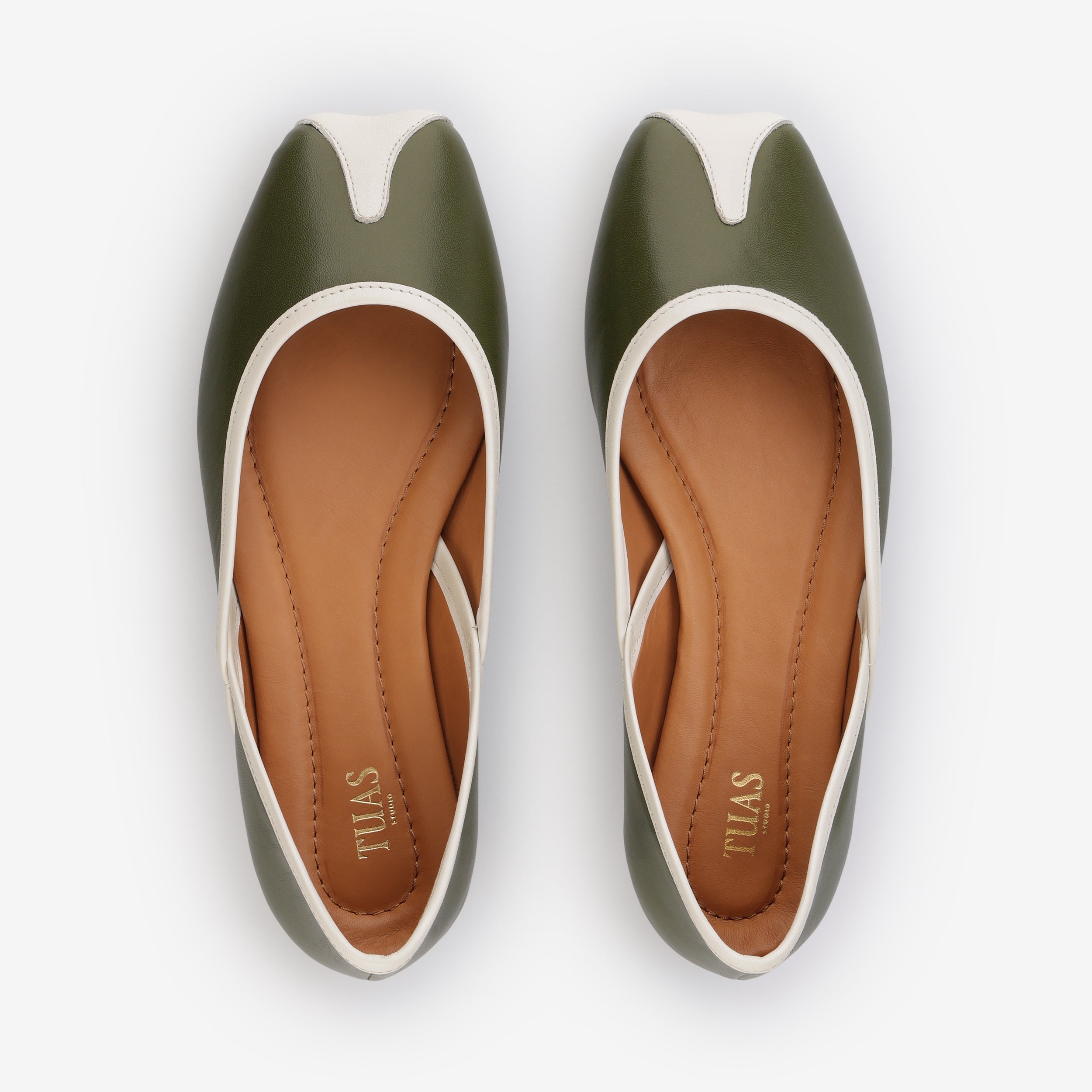 TUAS Julia olive green flat shoe with white accents on a white background